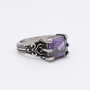 Vintage silver-tone signet ring featuring a large square purple gemstone and carvings