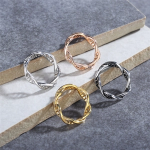 DNA double helix rings in silver, gold, rose gold, and black finishes on stone