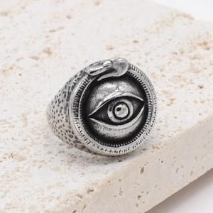 Retro stainless steel ring featuring Eye of Horus and snake carving on stone