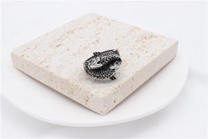 Close-up of vintage koi fish titanium steel ring with detailed scales and relief texture