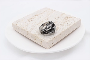 Detailed relief of vintage koi fish scales on a retro style stainless steel ring