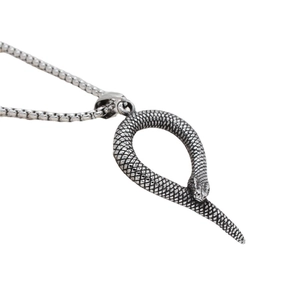 Vintage silver snake pendant necklace with detailed scales on a steel box chain