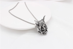 Detail shot of vintage Prajna pendant with intricate engraving and sturdy box chain