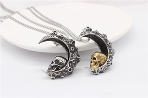 Detail of moon and skull pendant with meteorite texture and gothic punk style