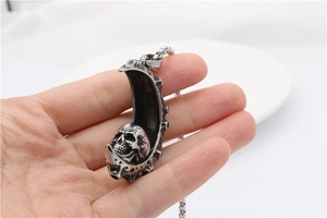 Gothic punk crescent moon and skull pendant necklace crafted from silver steel