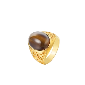 Detailed side view of vintage gold titanium steel ring with hollow engraved pattern