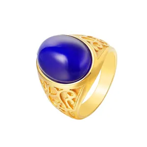 Vintage gold titanium steel ring with large oval blue cat's eye gemstone and filigree