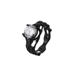 Macro shot of gothic black skull ring featuring a large sparkling round centerpiece stone