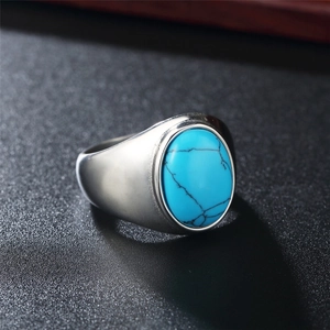 Vintage stainless steel ring featuring an oval blue turquoise stone with natural black veins