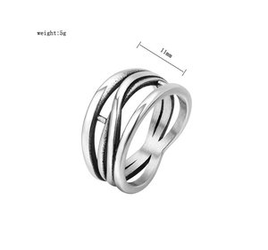 Detailed view of 11mm irregular layered titanium steel ring with vintage brushed finish