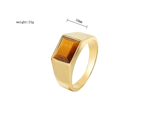 Macro detail of men's gold titanium ring with 10mm tiger eye stone and 21g weight