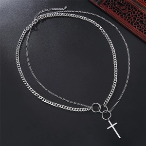 Double-layered stainless steel necklace with cross pendant on black textured background