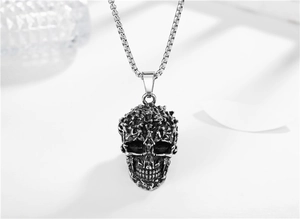 Macro shot of gothic skull pendant with vintage silver finish and detailed box chain