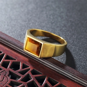 Polished gold stainless steel wide band ring with rectangular tiger eye gemstone inlay