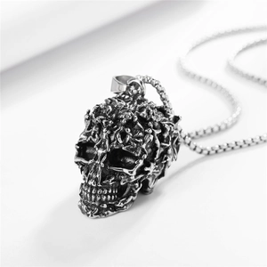 Gothic skull pendant necklace in stainless steel with detailed relief carvings and chain