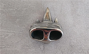 Macro detail of gothic style stainless steel double-finger ring with sharp metal spikes