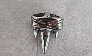Detailed view of 316L stainless steel beast claw pendant with vintage textured finish