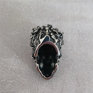 Gothic style silver skull pendant necklace with intricate vintage embossed details and patterns