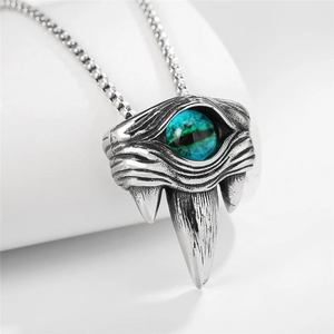 Gothic evil eye pendant necklace with beast fang design and blue stone in vintage silver