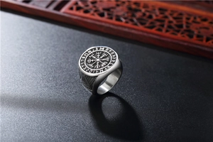 Detailed view of Viking compass Vegvisir and Runes engraving on stainless steel ring