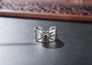 Macro detail of retro eagle relief on vintage punk style stainless steel open ring