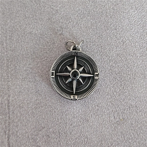 Vintage stainless steel compass pendant with black onyx center and N E S W engraving