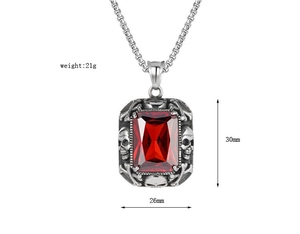 Détail du pendentif gothique tête de mort avec pierre rouge et dimensions 30x26mm