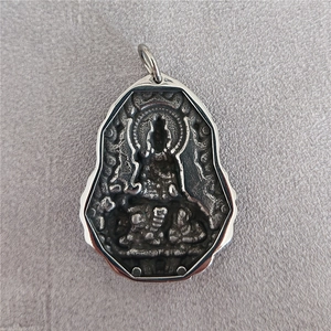 Vintage Guanyin Buddha relief pendant in stainless steel with antique finish and halo detail