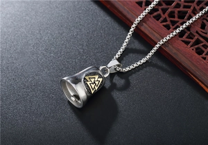Detail of Viking Valknut bell pendant in silver and gold steel with square box chain