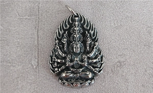 Detailed relief of Avalokitesvara Bodhisattva pendant in vintage silver steel