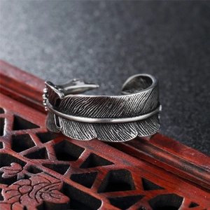 Retro oxidized silver feather ring with detailed carvings and open adjustable design