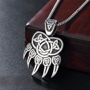 Retro Viking bear claw pendant necklace with Celtic knot patterns in vintage steel