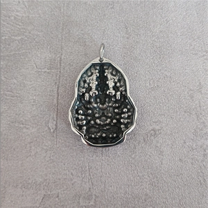 Guanyin Buddha pendant in stainless steel with embossed metallic texture and silver finish