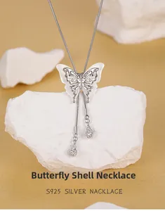 Macro shot of S925 silver butterfly necklace featuring white shell wings and silver drops