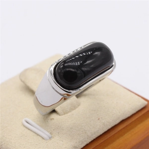 Men's wide band silver ring featuring a large oval black onyx gemstone in a cabochon cut