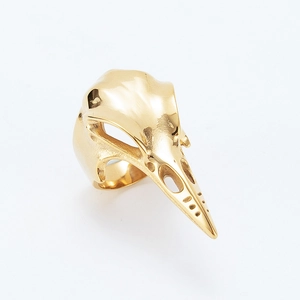 Gothic woodpecker skull ring in polished gold finish with intricate bone detailing