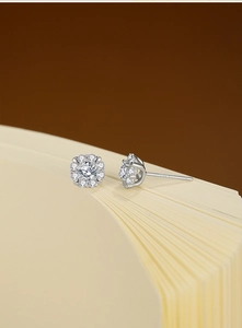 Macro shot of S925 sterling silver flower stud earring with moissanite stones