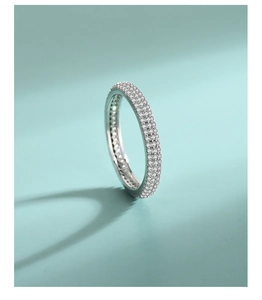 Macro shot of 925 sterling silver ring with triple row of micro-paved sparkling crystals