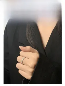 Detailed model shot of a minimalist triple row full diamond S925 silver ring for women