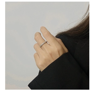 Detail of S925 sterling silver eternity ring with triple rows of shimmering zircons