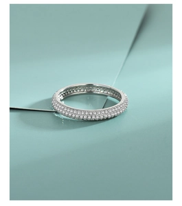 Macro detail of triple row pavé-set crystals on elegant S925 sterling silver band