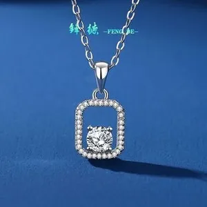 Macro detail of S925 silver necklace with rectangular moissanite bow pendant