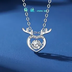 Detail view of S925 silver necklace featuring a heart and antler pendant with zirconia
