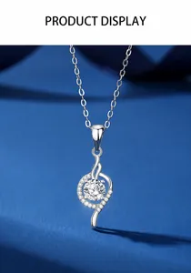 Close-up of heart-shaped sterling silver necklace with a 1-carat moissanite pendant