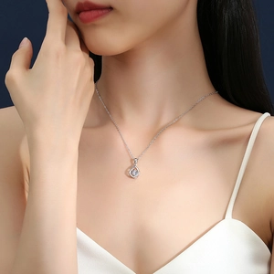 Elegant S925 silver heartbeat necklace with sparkling teardrop crystal pendant on model