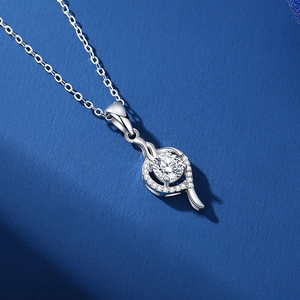 Elegant s925 silver necklace with heart-shaped moissanite pendant on blue background
