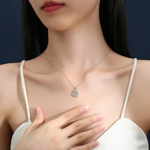 Elegant S925 silver necklace with dancing moissanite pendant and bow on model