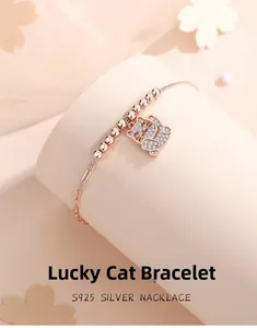Detailed shot of S925 silver lucky cat bracelet with sparkling pavé crystals