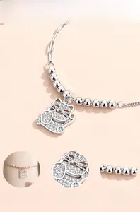 Detailed close-up of lucky cat silver bracelet with sparkling cubic zirconia inlay