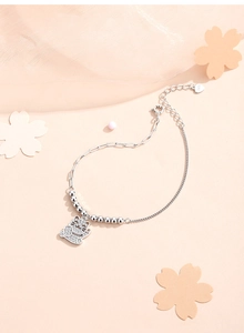 Detailed close-up of S925 silver lucky cat bracelet with sparkling pavé crystals